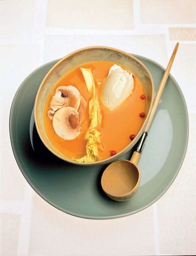 Pumpkin soup with chestnuts and raw vegetables and curd cheese
