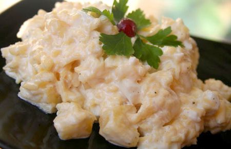 Salad with pineapple, cheese and squid