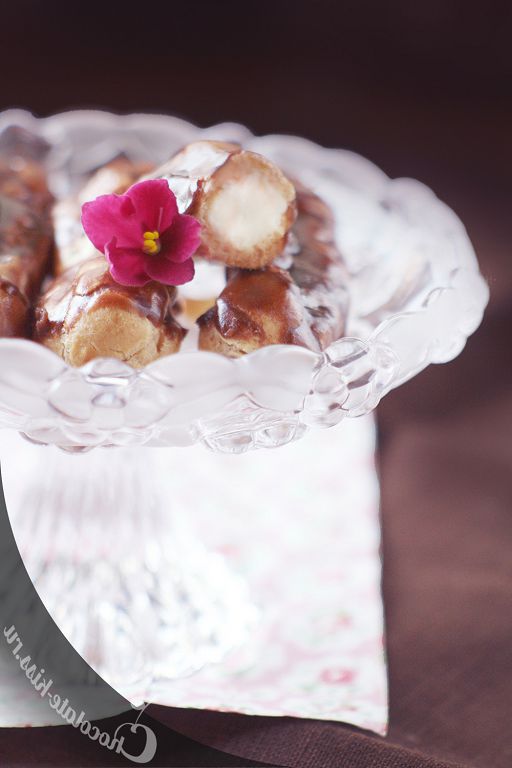 Eclairs with custard and cherry