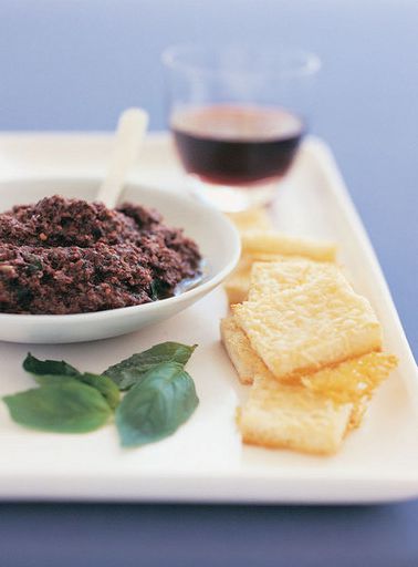 Toast with parmesan and black olive paste