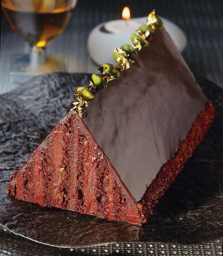 Chocolate cake with cream and pistachios