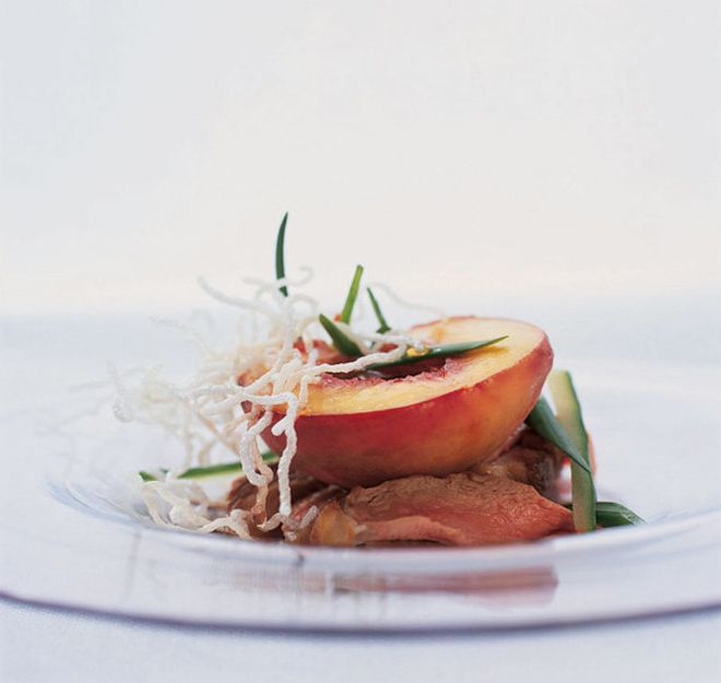 Salad of duck breast and peaches in maple syrup
