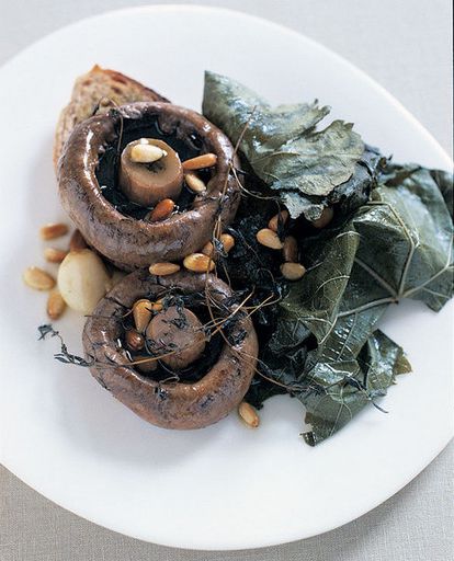 Toast with mushrooms, baked in grape leaves