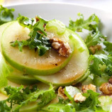 Apple salad with walnuts in caramel