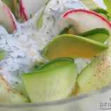 Salad with avocado, cucumber, radish and a yogurt sauce Salad with avocado, cucumber, radish and a yogurt sauce