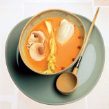 Pumpkin soup with chestnuts and raw vegetables and curd cheese