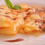 Pancakes with nut filling and chocolate sauce Pancakes with nut filling and chocolate sauce