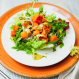 Green salad with baked pumpkin, goat cheese and dressing seafood Green salad with baked pumpkin, goat cheese and dressing seafood