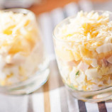 Layered salad with ham, corn, cheese and pineapple Layered salad with ham, corn, cheese and pineapple