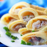 Russian pancakes with herring and onions Russian pancakes with herring and onions