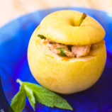Apples stuffed with chicken, prunes and walnuts
