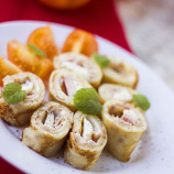 Rolls of thin pancakes with cream cheese and mozzarella Rolls of thin pancakes with cream cheese and mozzarella